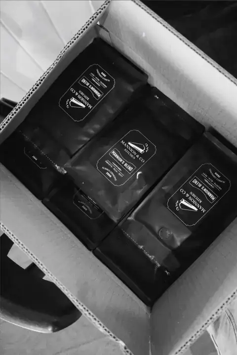 A box of freshly bagged coffee ready to go out