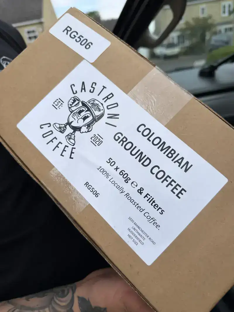 A box of Colombian ground coffee filters ready for delivery