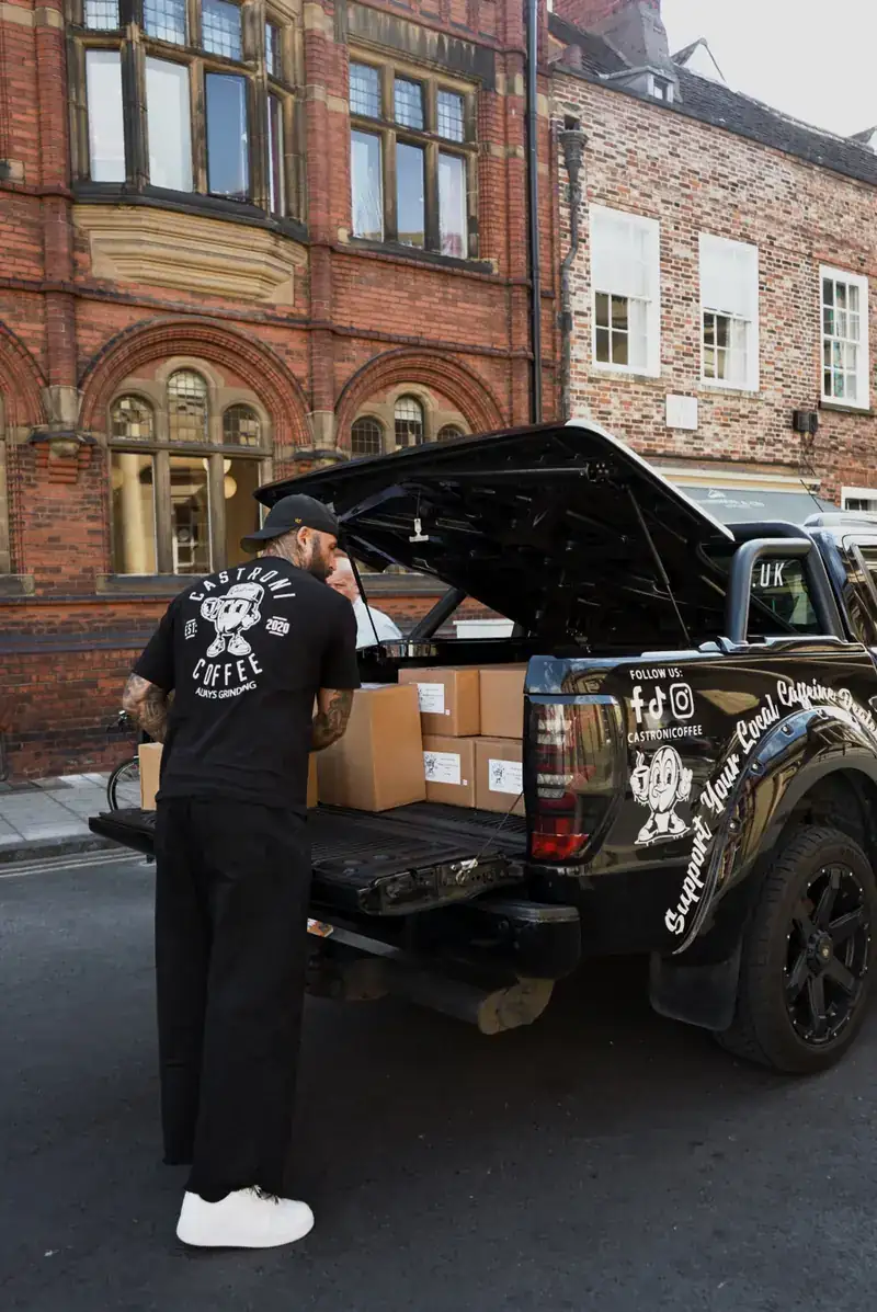Unloading the pickup outside a customer's shop