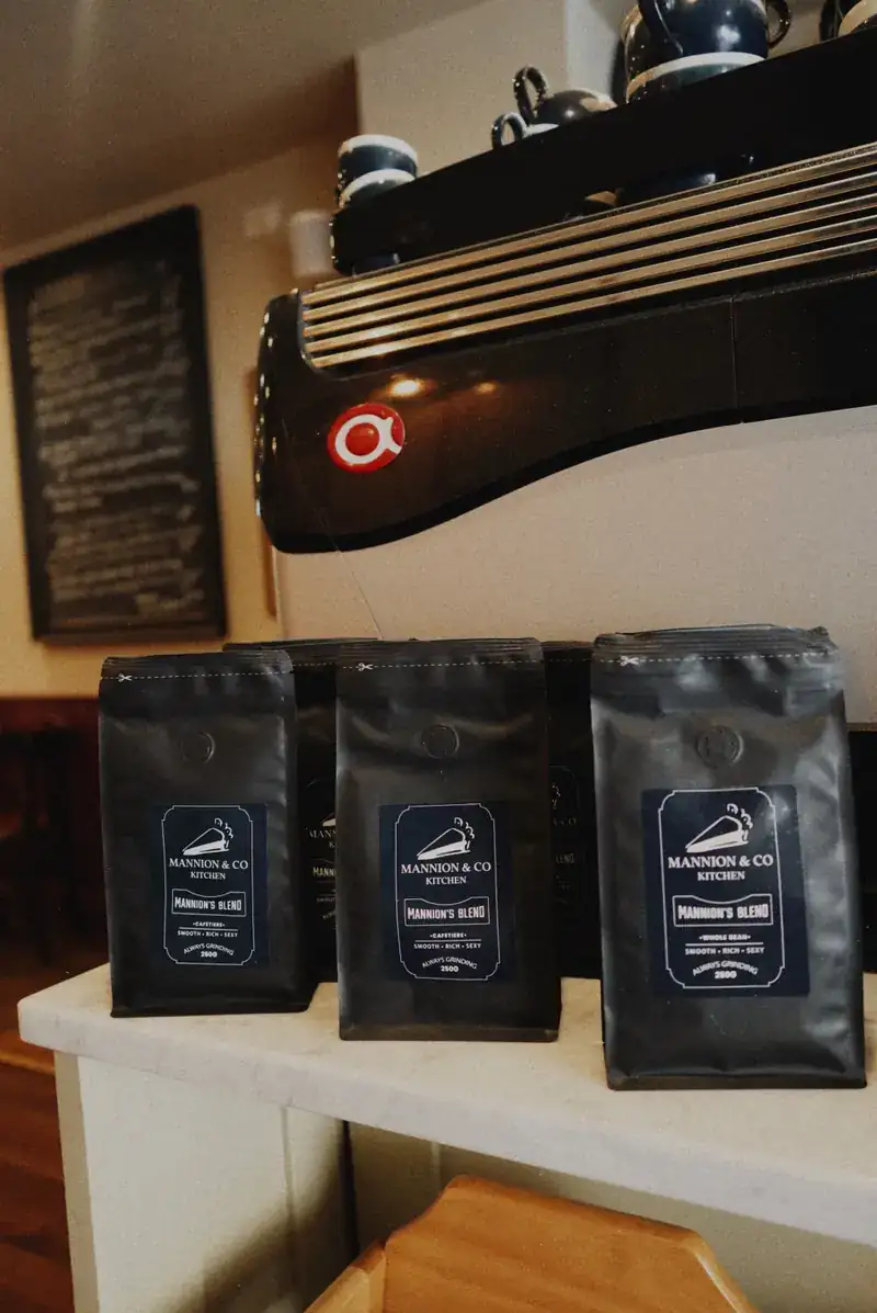 Castroni pouches on a café retail shelf